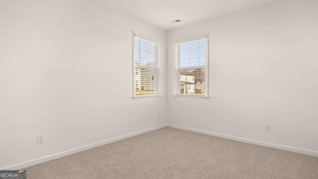 1109 Blue Juniper Cir, Loganville, GA 30052 - carpeted empty room featuring baseboards