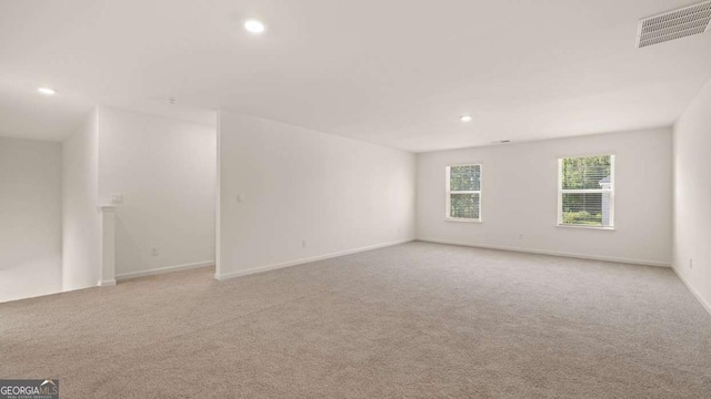 1109 Blue Juniper Cir, Loganville, GA 30052 - empty room featuring recessed lighting and light colored carpet