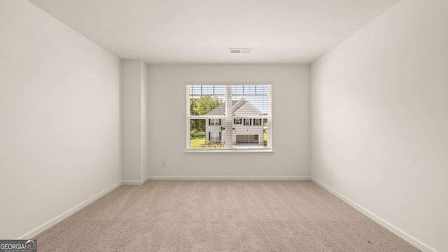 1109 Blue Juniper Cir, Loganville, GA 30052 - empty room featuring light colored carpet and baseboards