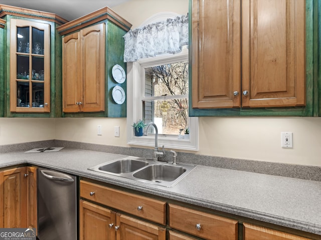 kitchen with a sink, stainless steel dishwasher, glass insert cabinets, and brown cabinetry