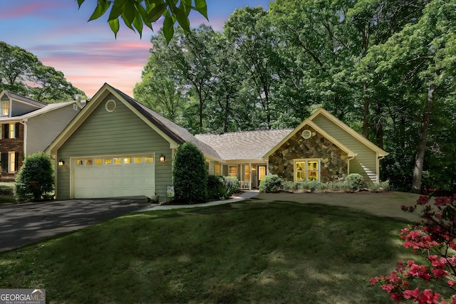 1390 Barclay Dr, Lawrenceville, GA 30043 - ranch-style home with a front lawn, aphalt driveway, stone siding, and a garage