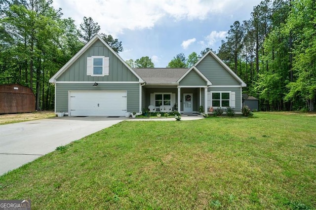 view of front of house with board and batten siding, concrete driveway, a storage unit, a garage, and a porch