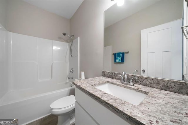 bathroom featuring toilet, vanity, bathtub / shower combination, and wood finished floors