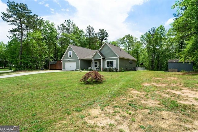 single story home featuring concrete driveway, a front yard, a garage, and a shed