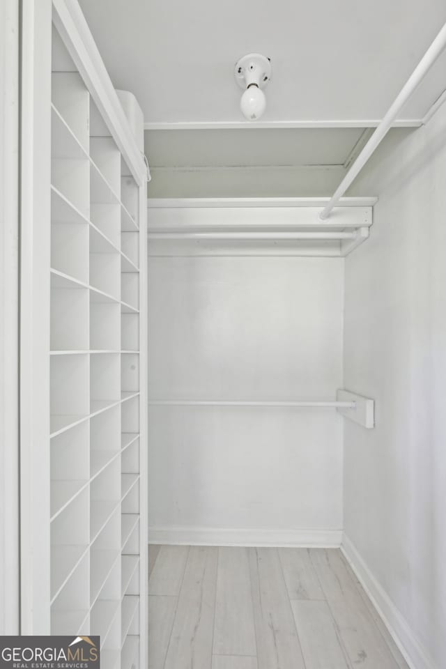 285 Lakemoore Dr NE Unit A, Atlanta, GA 30342 - walk in closet featuring wood finished floors