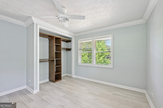 285 Lakemoore Dr NE Unit A, Atlanta, GA 30342 - unfurnished bedroom featuring wood finished floors, a textured ceiling, baseboards, and ornamental molding