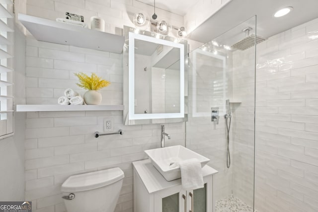 285 Lakemoore Dr NE Unit A, Atlanta, GA 30342 - full bathroom featuring toilet, walk in shower, a sink, and tile walls