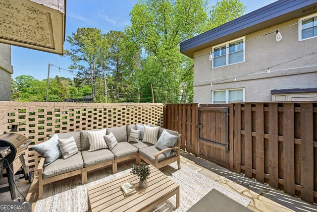285 Lakemoore Dr NE Unit A, Atlanta, GA 30342 - view of patio / terrace with a gate, outdoor lounge area, and fence