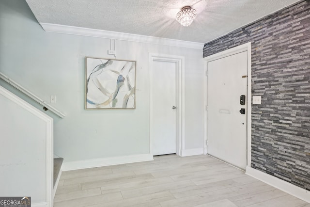 285 Lakemoore Dr NE Unit A, Atlanta, GA 30342 - entrance foyer with crown molding, wood finished floors, and a textured ceiling