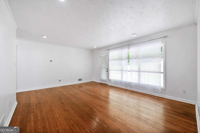 3050 Rebecca Dr SW, Atlanta, GA 30311 - unfurnished room with wood finished floors, crown molding, and recessed lighting