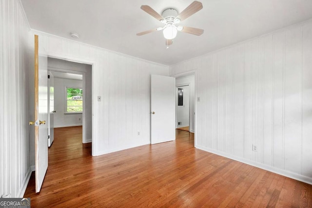 3050 Rebecca Dr SW, Atlanta, GA 30311 - unfurnished room with wood finished floors, a ceiling fan, ornamental molding, and a smoke detector