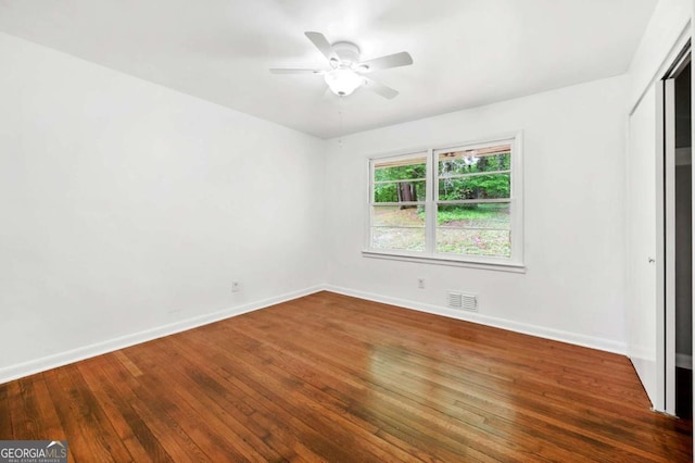 3050 Rebecca Dr SW, Atlanta, GA 30311 - unfurnished bedroom with wood-type flooring, a closet, and a ceiling fan