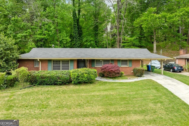 3050 Rebecca Dr SW, Atlanta, GA 30311 - ranch-style home featuring brick siding, driveway, a front lawn, and a carport
