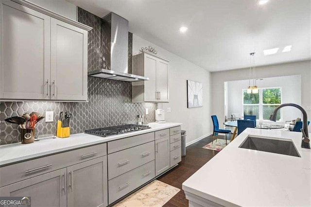 312 Wichita Way, Mcdonough, GA 30253 - kitchen featuring wall chimney exhaust hood, light countertops, a sink, and stainless steel gas stovetop