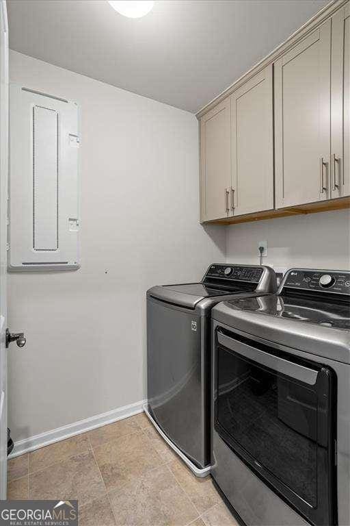 312 Wichita Way, Mcdonough, GA 30253 - laundry area featuring cabinet space, independent washer and dryer, and baseboards