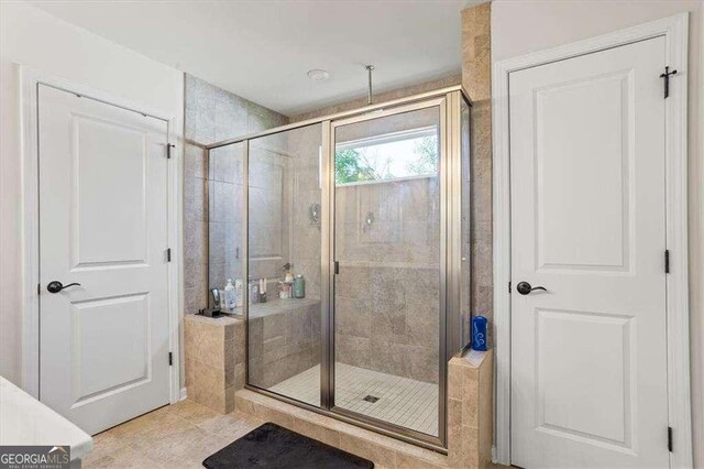 312 Wichita Way, Mcdonough, GA 30253 - bathroom featuring tile patterned flooring and a shower stall