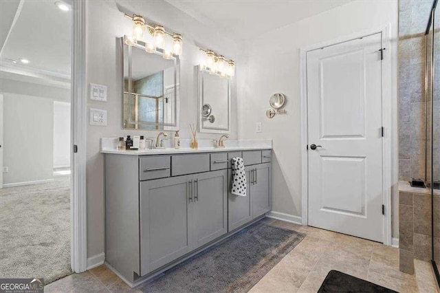 312 Wichita Way, Mcdonough, GA 30253 - bathroom featuring walk in shower, double vanity, baseboards, and a sink