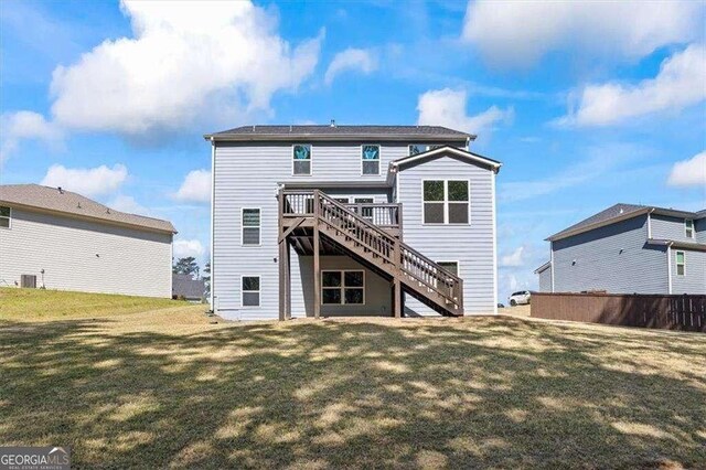 312 Wichita Way, Mcdonough, GA 30253 - rear view of property featuring a wooden deck, a lawn, stairs, and cooling unit