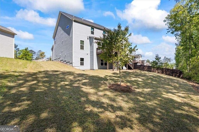 312 Wichita Way, Mcdonough, GA 30253 - back of property with a lawn, fence, a deck, and stairs