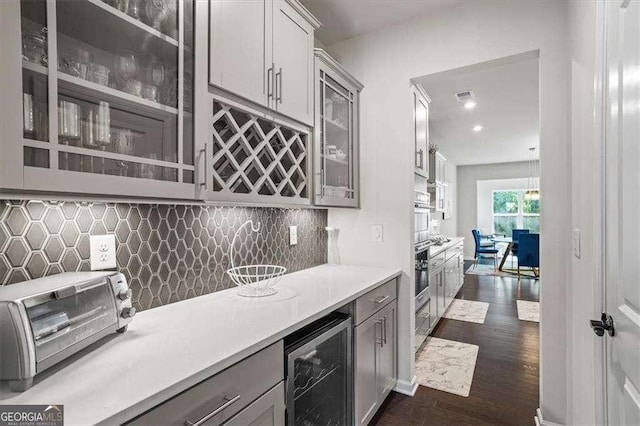 312 Wichita Way, Mcdonough, GA 30253 - bar featuring tasteful backsplash, indoor wet bar, a toaster, dark wood-type flooring, and wine cooler