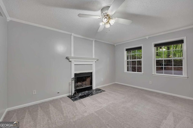 unfurnished living room with carpet flooring, a textured ceiling, and crown molding