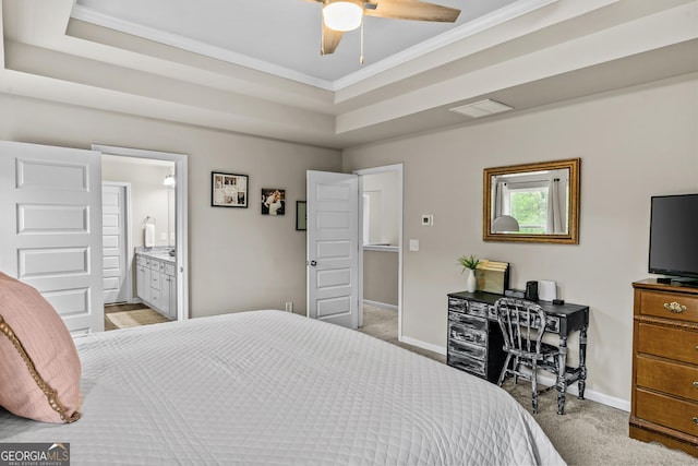 carpeted bedroom with a raised ceiling, visible vents, crown molding, and baseboards
