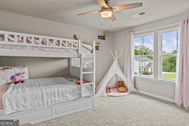 bedroom featuring baseboards, visible vents, carpet flooring, and ceiling fan