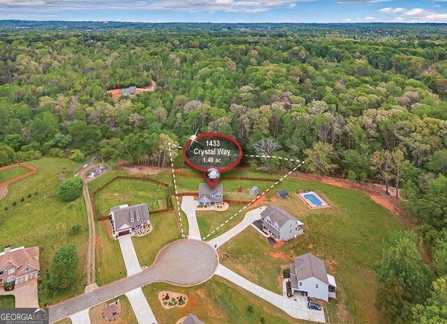 drone / aerial view with a forest view