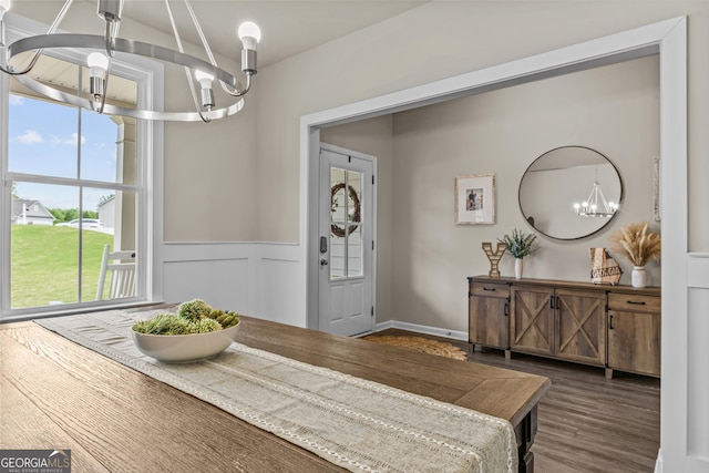 dining room featuring a chandelier and wood finished floors