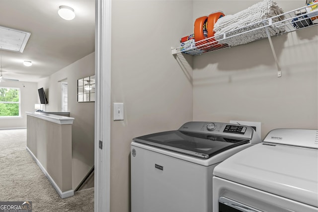 laundry area with carpet, washing machine and clothes dryer, baseboards, and laundry area