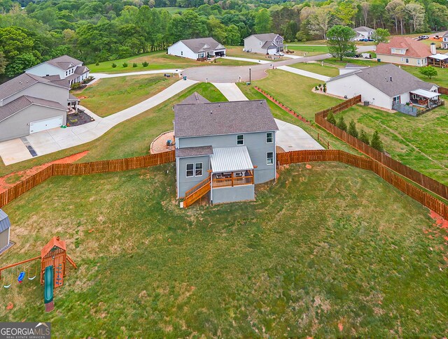birds eye view of property with a residential view