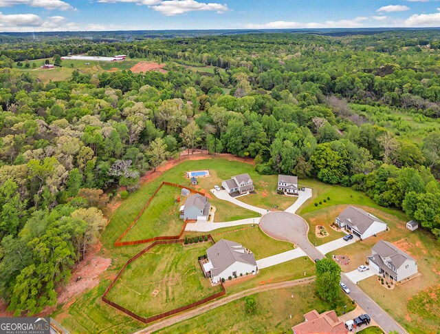 bird's eye view with a forest view