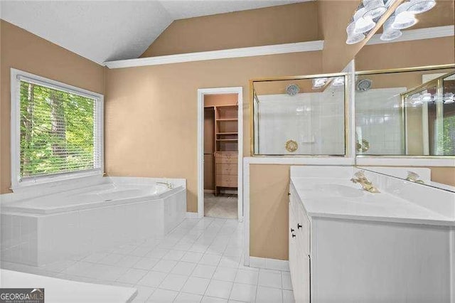 full bath featuring lofted ceiling, tile patterned flooring, vanity, a bath, and a stall shower