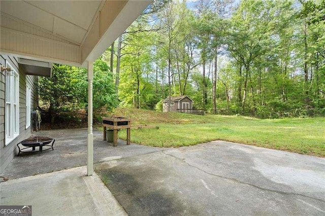 view of patio / terrace with an outbuilding