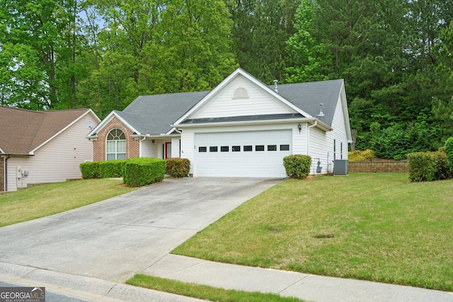 single story home with driveway, central air condition unit, a front lawn, an attached garage, and a shingled roof