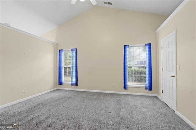 carpeted spare room with baseboards, visible vents, and ceiling fan