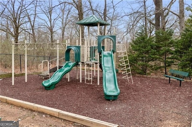 communal playground featuring fence