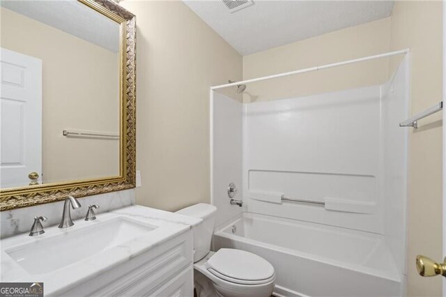 full bathroom featuring toilet,  shower combination, visible vents, and vanity