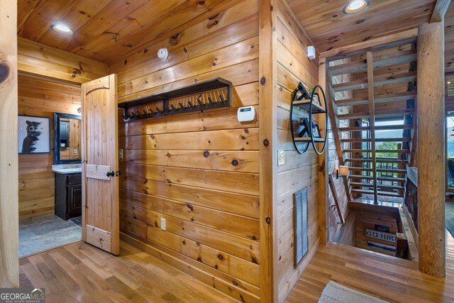 interior space featuring recessed lighting, wood finished floors, wood walls, and wooden ceiling