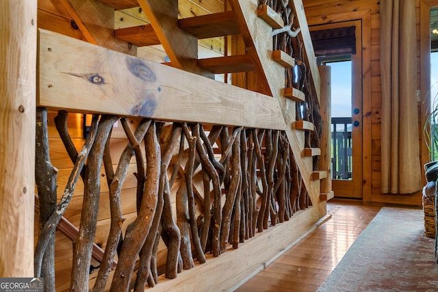 staircase featuring wood-type flooring