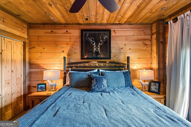 bedroom with wood walls and wooden ceiling
