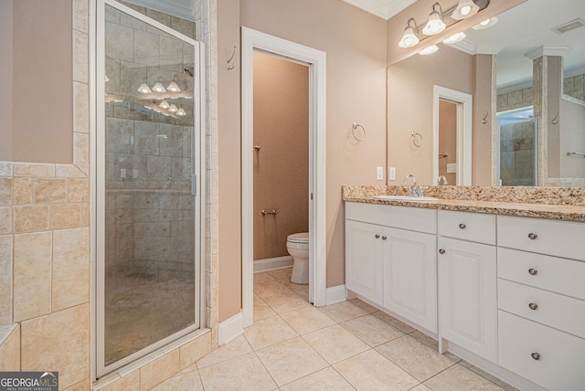 bathroom featuring a shower stall, ornamental molding, toilet, and vanity