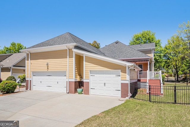 view of front of home featuring a shingled roof, driveway, and an attached garage