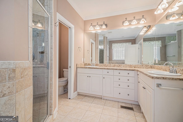 full bath with ornamental molding, a stall shower, toilet, tile patterned flooring, and vanity