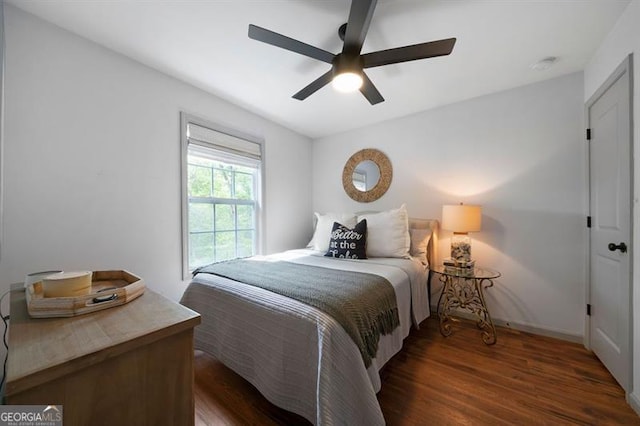 bedroom featuring wood finished floors and a ceiling fan