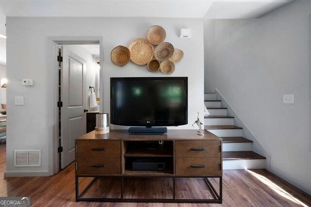 15 Swallow Dr, White, GA 30184 - living area featuring wood finished floors, stairway, and baseboards