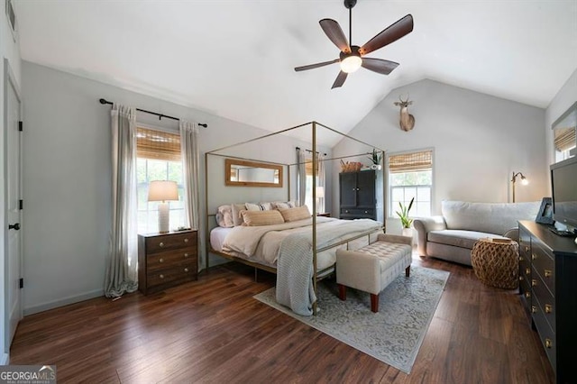 bedroom with lofted ceiling, baseboards, a ceiling fan, and dark wood-type flooring