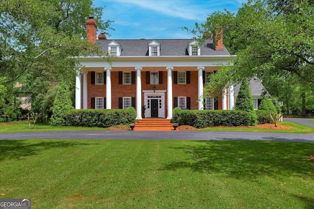 5 Prather Woods Ln, Augusta, GA 30909 - greek revival house featuring a front lawn, brick siding, a chimney, and covered porch