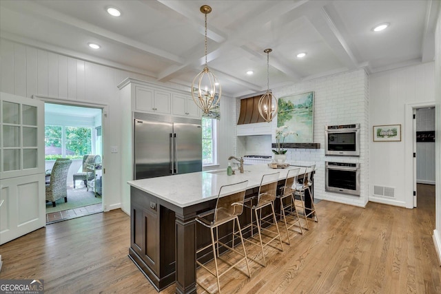5 Prather Woods Ln, Augusta, GA 30909 - kitchen with a sink, light wood-type flooring, visible vents, pendant lighting, and appliances with stainless steel finishes