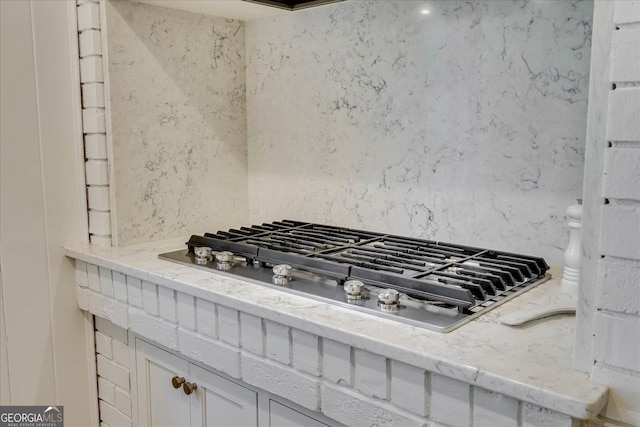 5 Prather Woods Ln, Augusta, GA 30909 - details featuring stainless steel gas cooktop, white cabinetry, and light stone counters
